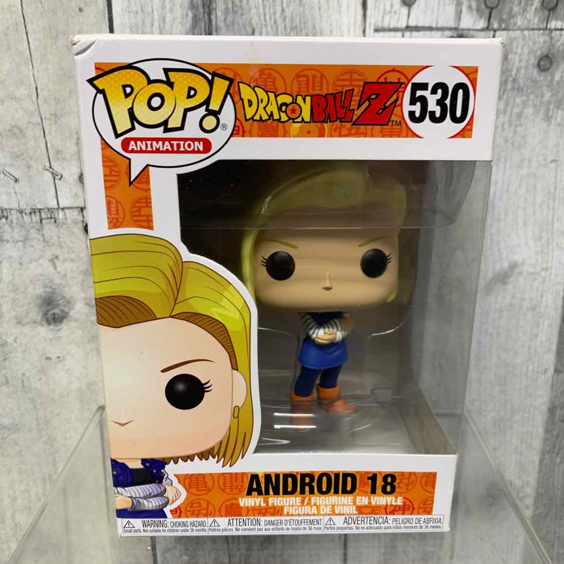 Funko Pop Orange/Yellow Action Figure