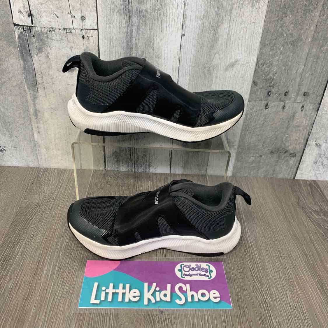 Size 12 Black/White New Balance Sneakers